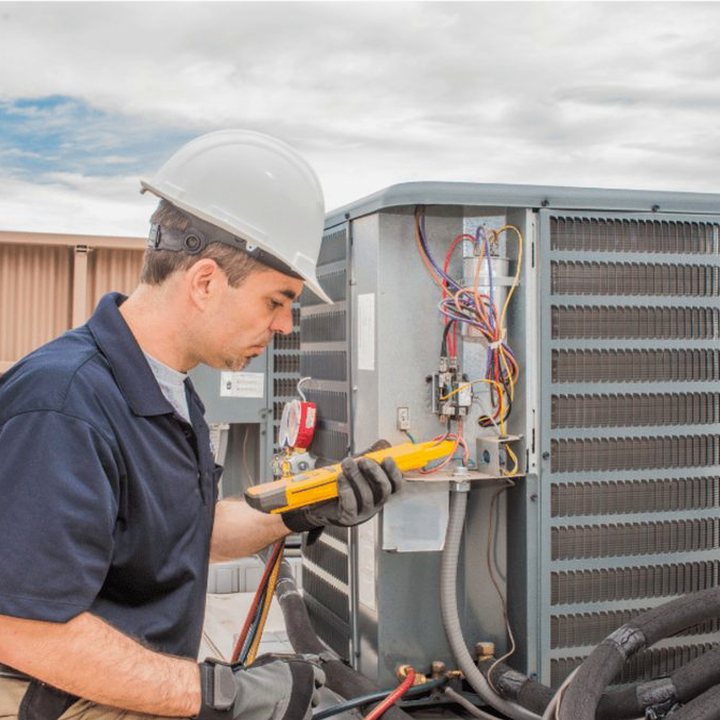 Collingwood Heating & Cooling HVAC technician on a service call in Collingwood, Ontario